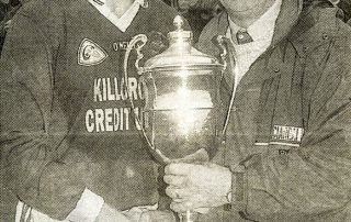 Liam Hassett (capt.) received the O Connor Cup from John Twiss, Chairman Mid-Kerry Board