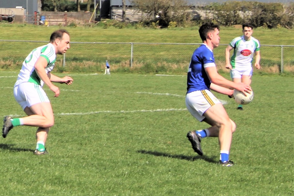 Calum Moriarty on the ball with Andrew Barry in pursuit