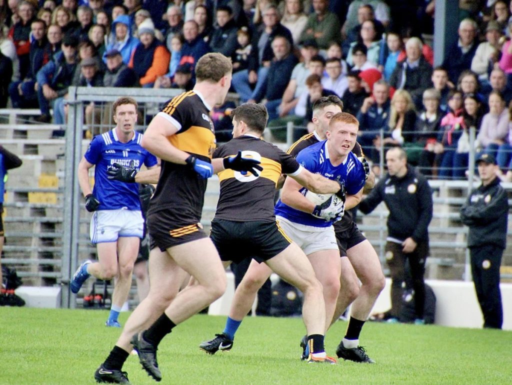 Shane Clifford in possession against Austin Stacks